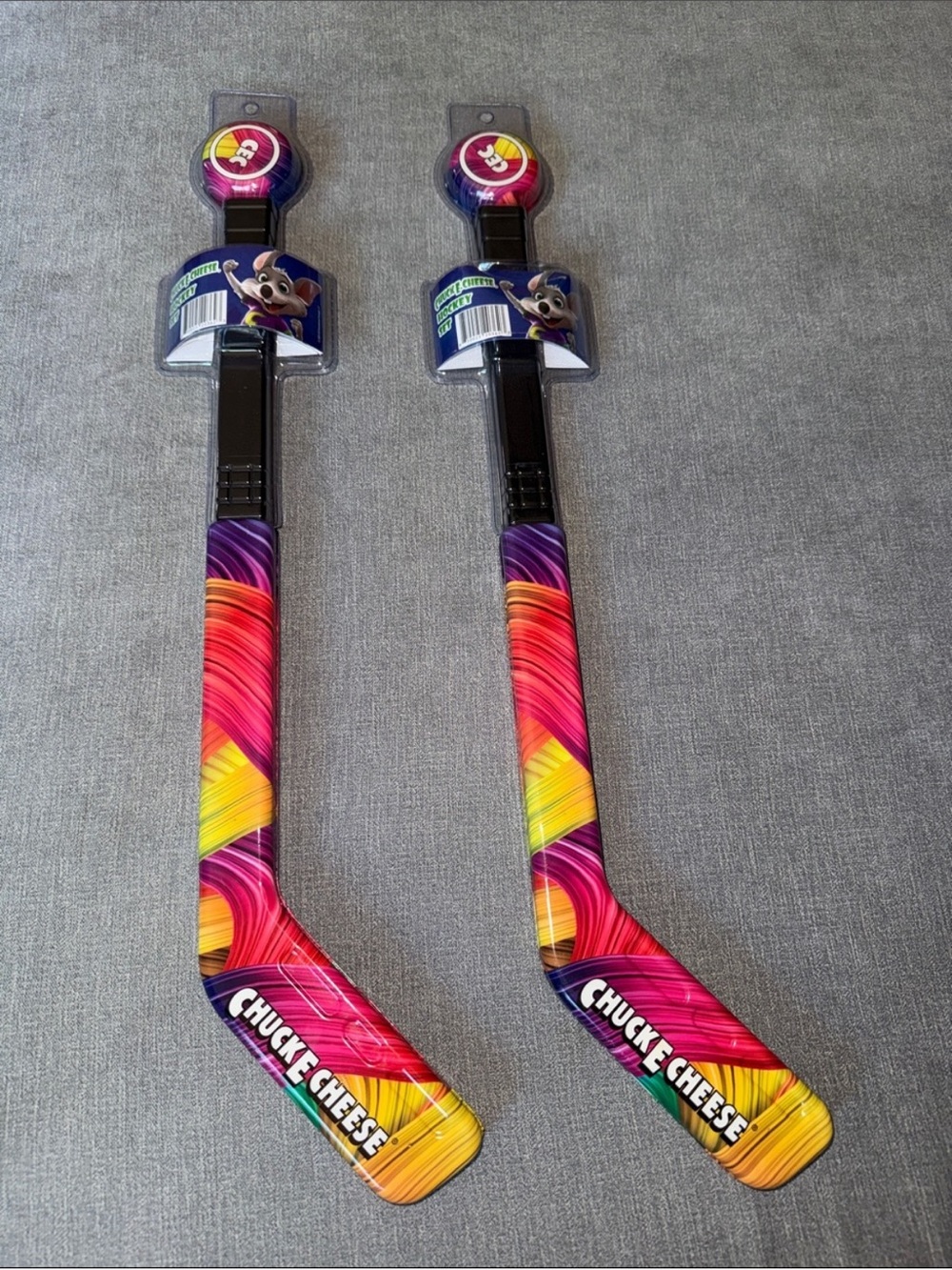 Chuck E. Cheese Kids' Hockey Sticks and Pucks - Colorful Swirl